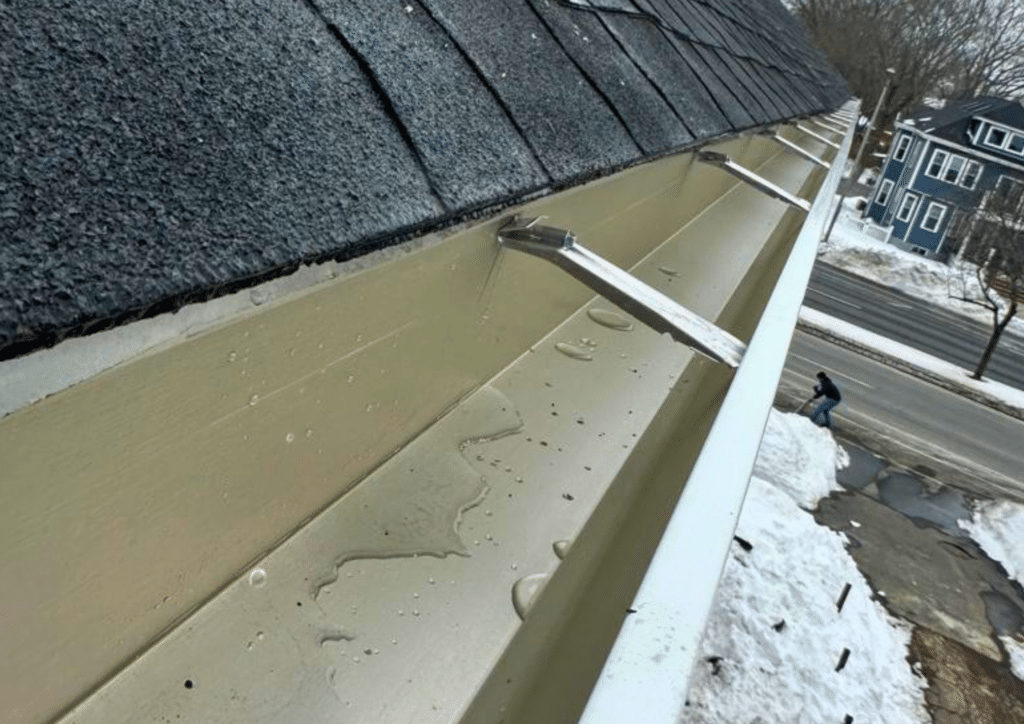 Do Gutters Go Under the Drip Edge