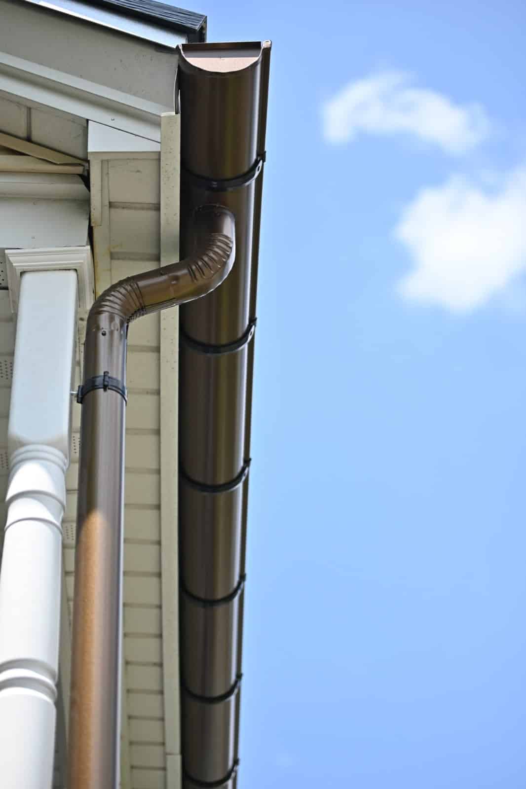 Copper gutter and downspout installed by Gutter IQ on a Boston-area home