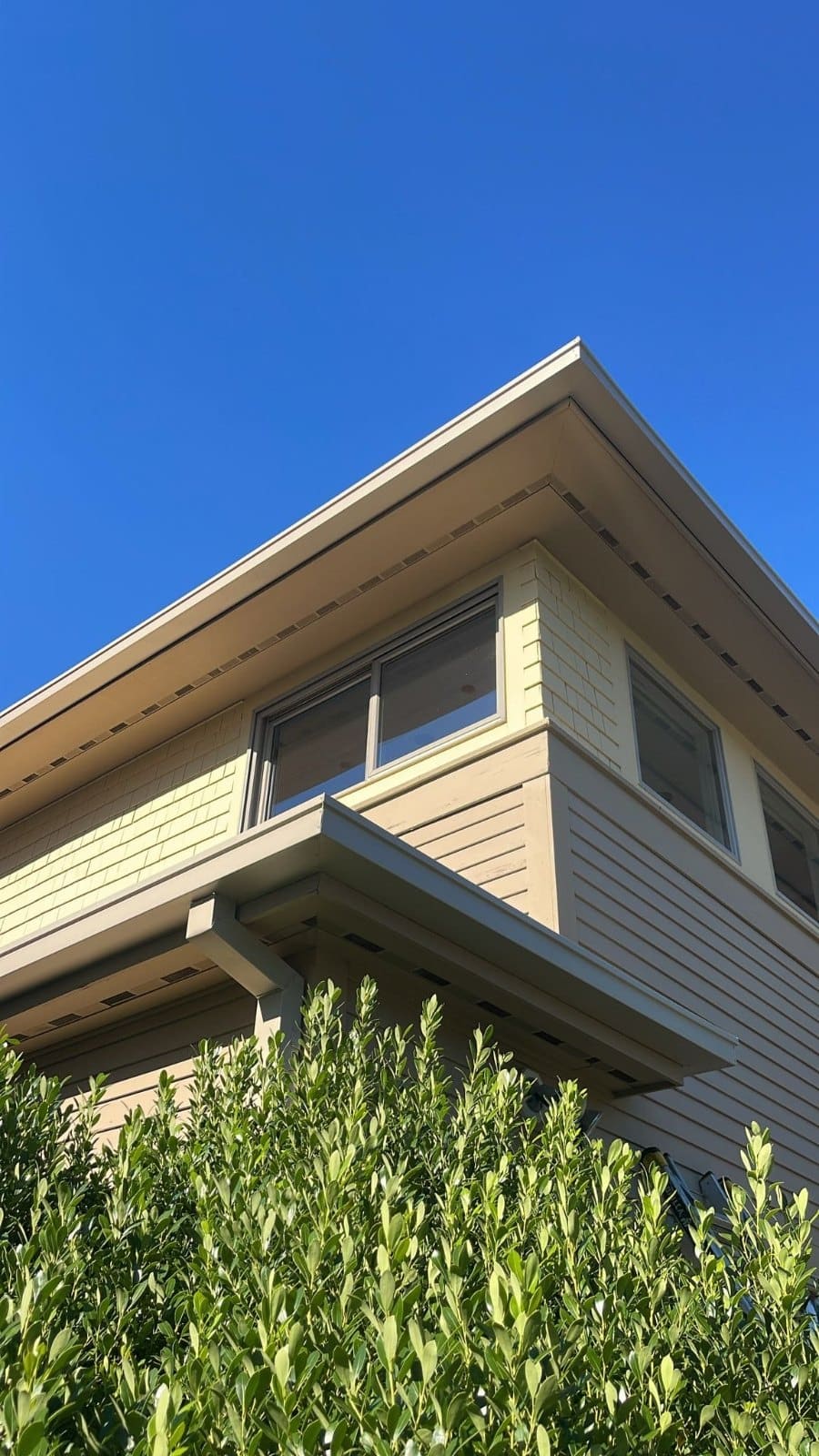 Seamless gutters installed along the roofline of a Boston-area home